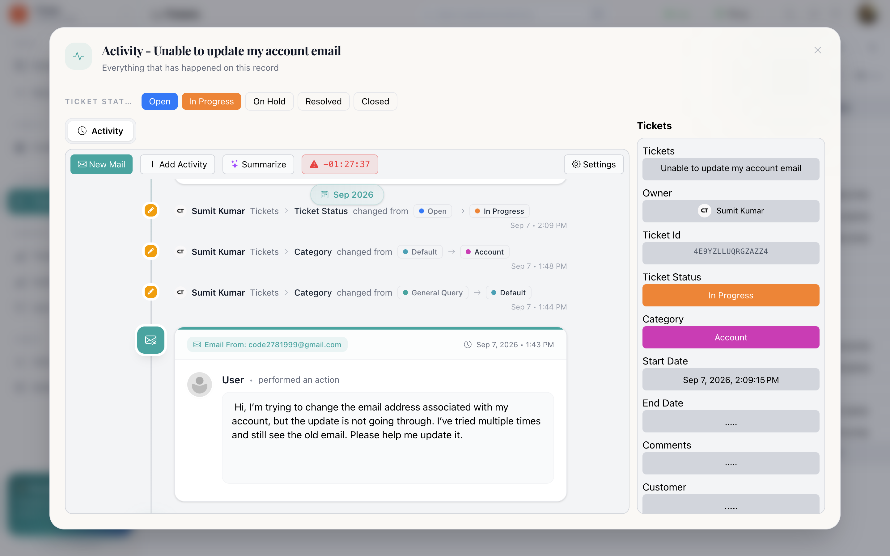 The record view with fields listed on the left and the activity timeline on the right, showing a field change, an email and a note grouped under a month heading